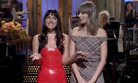 Taylor Swift diện váy kẻ caro sành điệu khi xuất hiện cùng Dakota Johnson